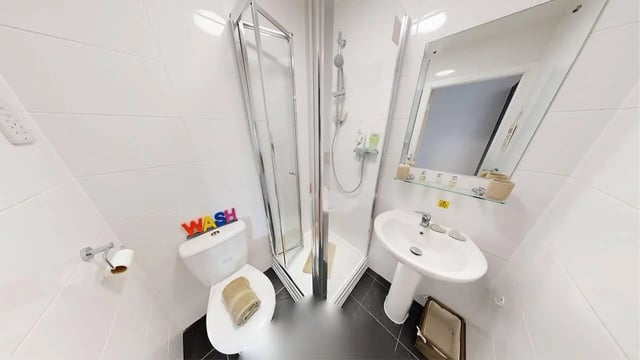 Toilet shower sink mirror with toiletries bathroom at Haigh Court in Liverpool Student Accommodation