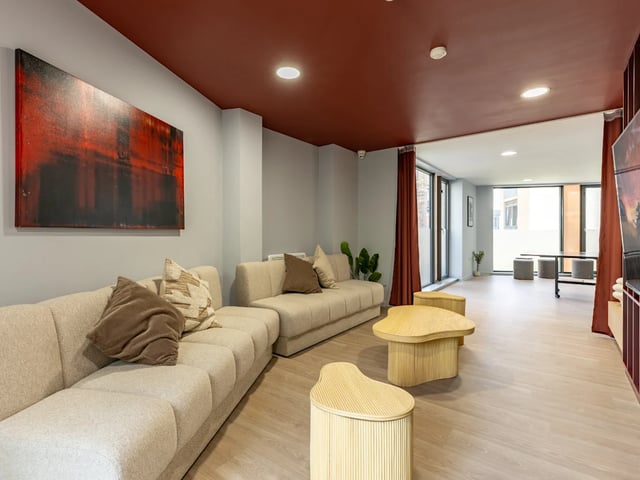 Sofa abstract art and tables communal area at Dunaskin Mill in Glasgow Student Accommodation