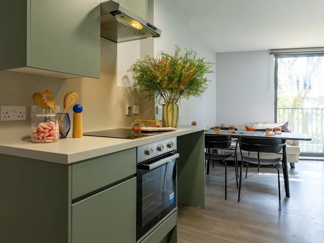 Kitchen with dining area and oven living area at Dunaskin Mill in Glasgow Student Accommodation
