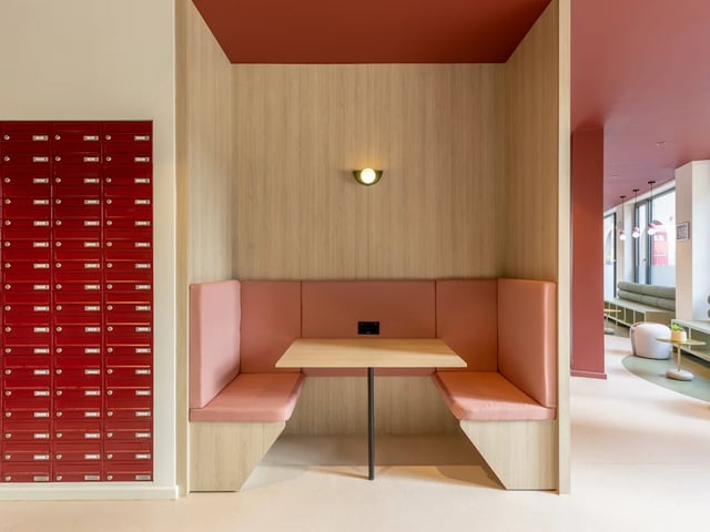 Red mailboxes pink booth table study area at Dunaskin Mill in Glasgow Student Accommodation
