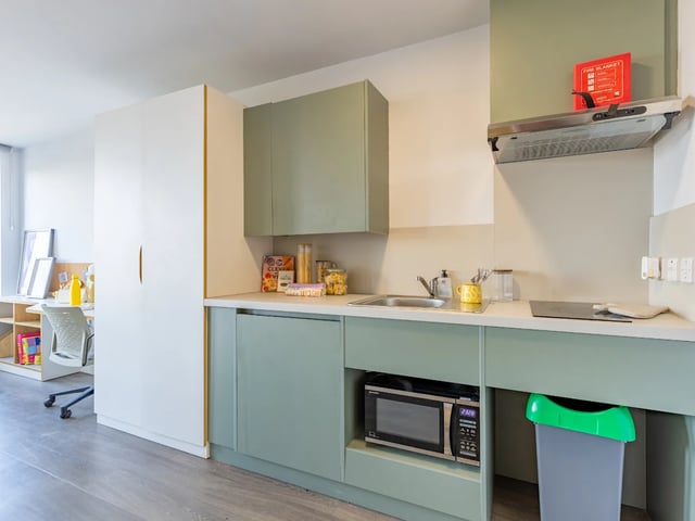 Microwave sink cupboards study desk and chair kitchen at Dunaskin Mill in Glasgow Student Accommodation