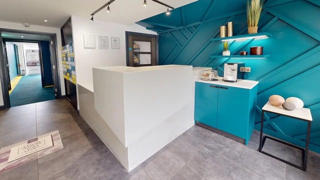 Reception desk and coffee machine interior view at The Residence in Coventry Student Accommodation