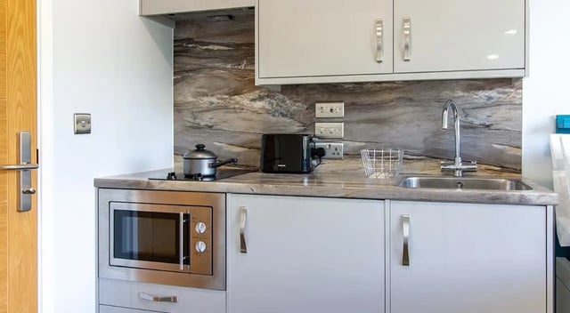 Small kitchen microwave toaster pot sink kitchen at Urban Student Village in Coventry Student Accommodation