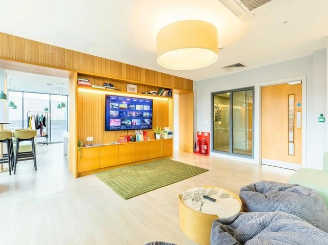 Bean bags TV and shelving unit common area at Straits Meadow in Edinburgh Student Accommodation