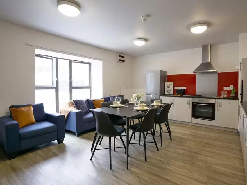 Sofa dining table kitchen living room kitchen at Paddington Park House in Liverpool Student Accommodation