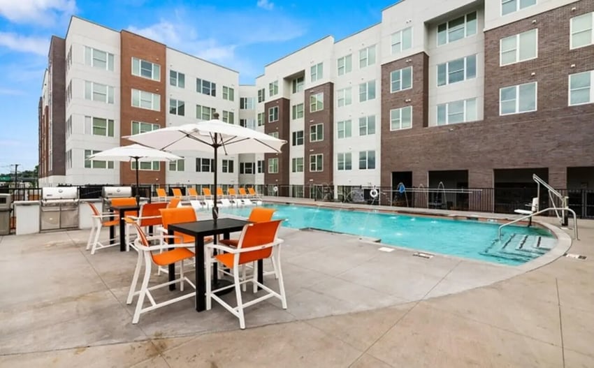 Grills tables chairs pool umbrellas outdoor playing area at Nova Knoxville in Knoxville Student Accommodation