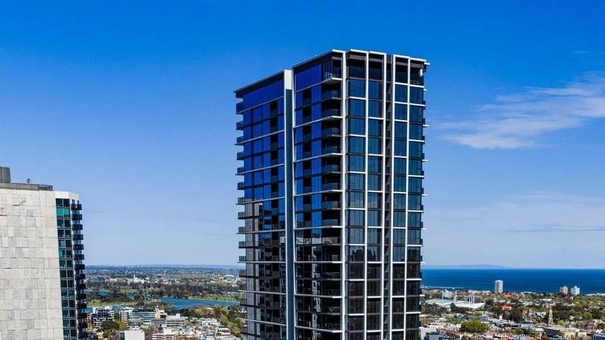 Modern high rise apartment building with balconies exterior at Indi Footscray in Melbourne Student Accommodation