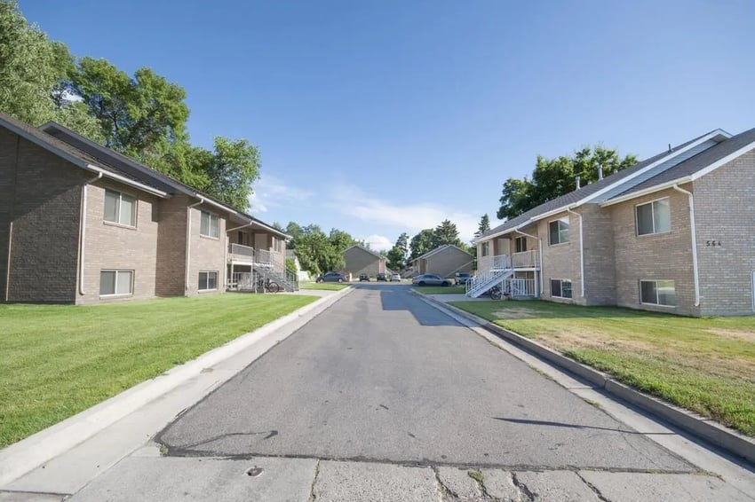 Apartment buildings with stairs and grassy lawns exterior at Afton Apartments in Logan Student Accommodation