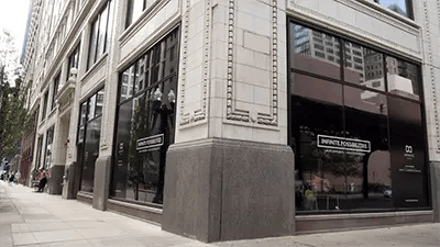 Corner building with large windows and signage exterior at INFINITE in Chicago Student Accommodation