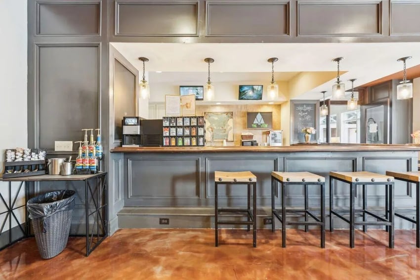 Bar area with coffee station and stools common area at The View Apartments in State College Student Accommodation