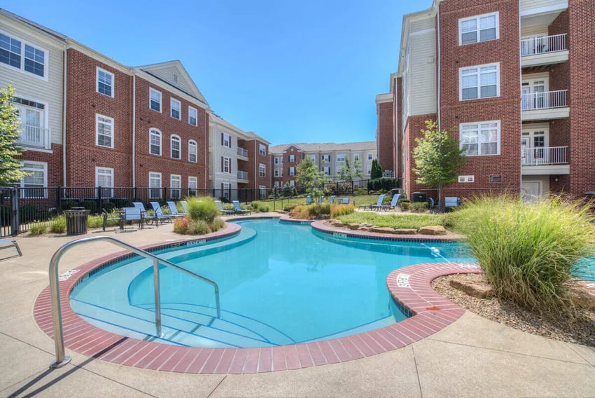 Apartment buildings pool lounge chairs grassy areas exterior at The Summit at Coates Run in Athens Student Accommodation