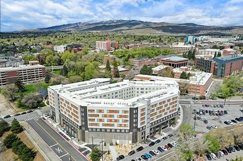 Modern dorm buildings with orange windows exterior at HERE Reno in Reno Student Accommodation