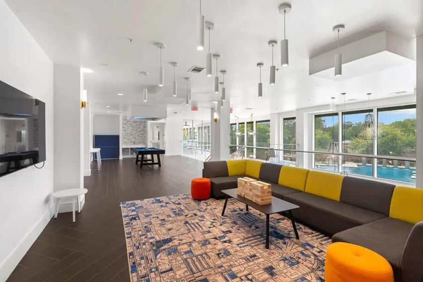 Sofa pool table rug and TV living room at The View on the Square in San Marcos Student Accommodation