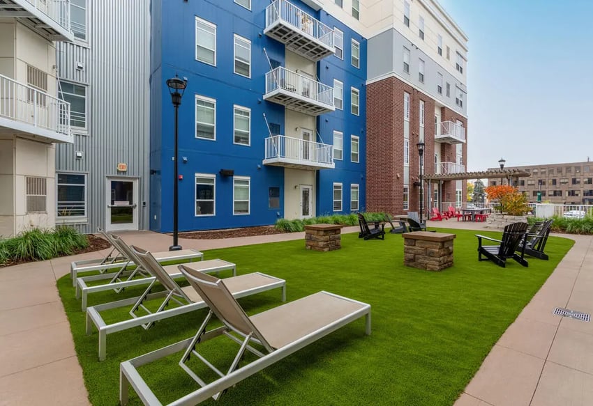 Lounge chairs and fire pits on lawn exterior at 44 North in Minneapolis Student Accommodation