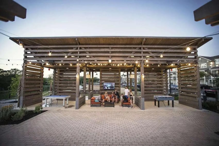 Wooden pavilion with seating tv foosball table exterior at Redpoint San Marcos in San Marcos Student Accommodation