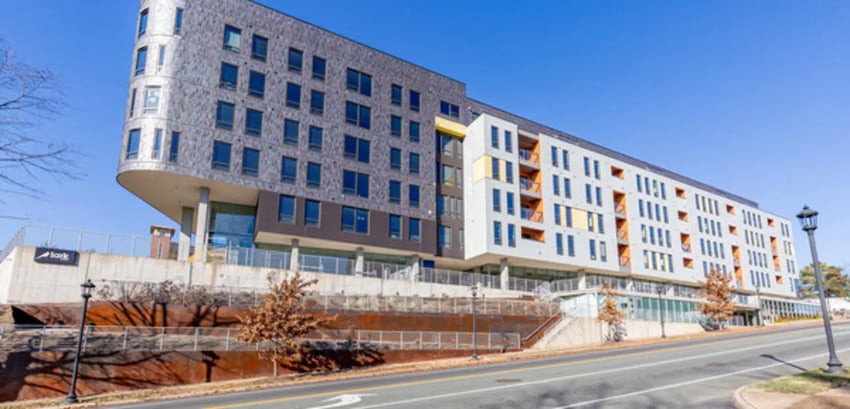 Modern building with multiple floors windows and balconies exterior at Lark on Main in Charlottesville Student Accommodation
