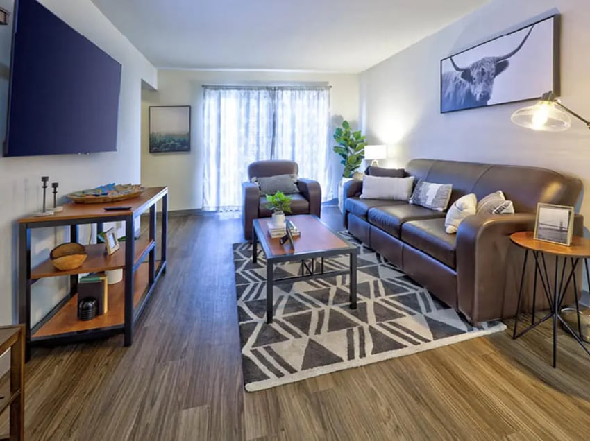 Brown leather sofa and chair living room living room at Willowtree Apartments & Tower in Ann Arbor Student Accommodation