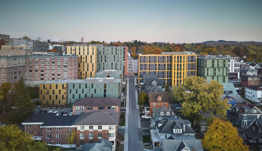 Modern apartments with yellow and green exteriors Exterior at Catherine Commons in Ithaca Student Accommodation