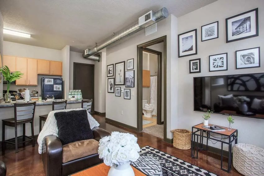 Leather chair kitchen area and bathroom living room at 4050 Lofts in Tampa Student Accommodation
