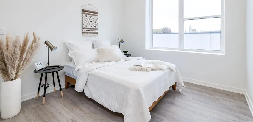White bed bedside table and pampas grass bedroom at Addams Coliving in Chicago Student Accommodation