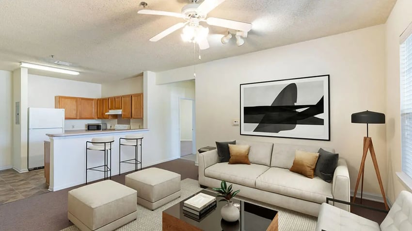 Sofa coffee table stools and kitchen area living room at Cape Trails in Cape Girardeau Student Accommodation