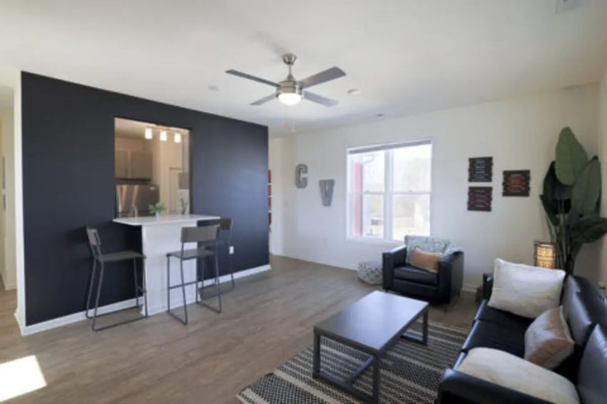 Living room with bar stools and couch living room at Clemson Village in Clemson Student Accommodation