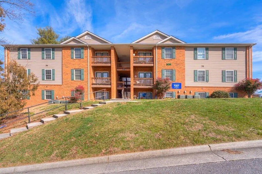 Brick apartment building with balconies and stairs exterior at Willow Creek Radford in Radford Student Accommodation