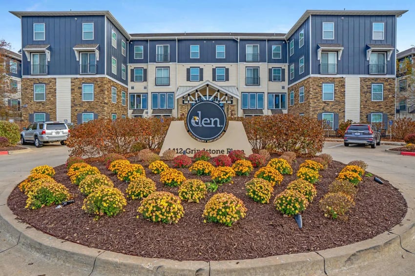 Modern apartments with landscaping and cars exterior at The Den Apartments in Berkeley Student Accommodation