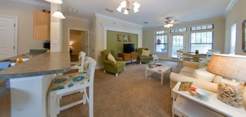 Bar and kitchen island with stools living room at Stratford Court Luxury Apartments in Gainesville Student Accommodation