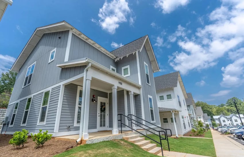 Gray townhouses with white trim and stairs exterior at Boulevard in Milledgeville Student Accommodation