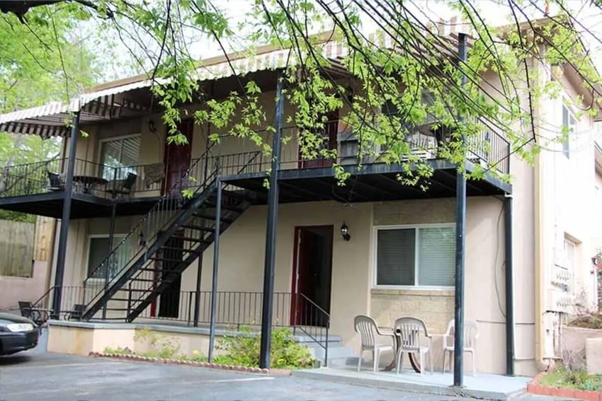 Black metal stairs balcony chairs tables exterior at Barristers Hall in Macon Student Accommodation