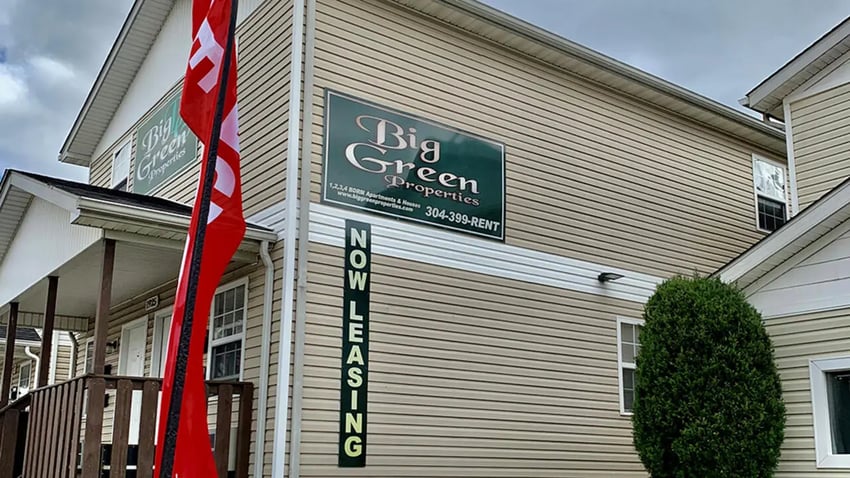 Big Green Properties sign red flag exterior at Big Green Properties in Huntington Student Accommodation