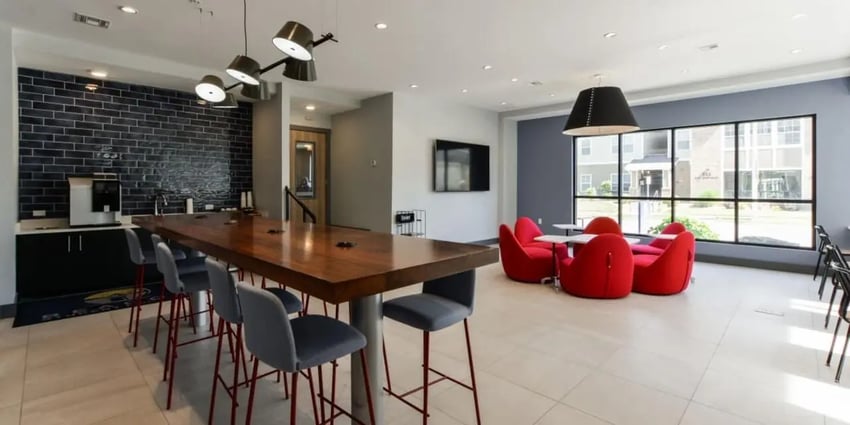 Communal lounge area with coffee maker and seating at Beacon Springfield in Springfield Student Accommodation