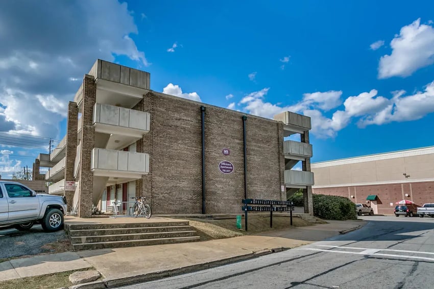 Brick building balconies stairs bicycle exterior at Cobblestone Court Apartments in Tuscaloosa Student Accommodation