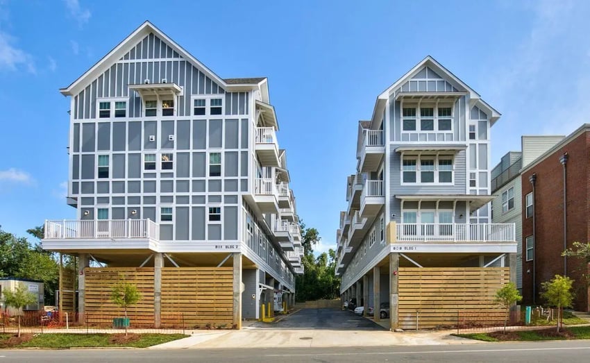 Modern apartment buildings with balconies and parking exterior at Ashburn Hills Townhomes in Tallahassee Student Accommodation