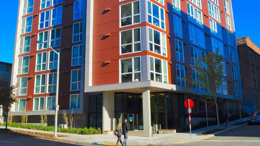 Modern building with many windows exterior at NORA Apartments in Seattle Student Accommodation