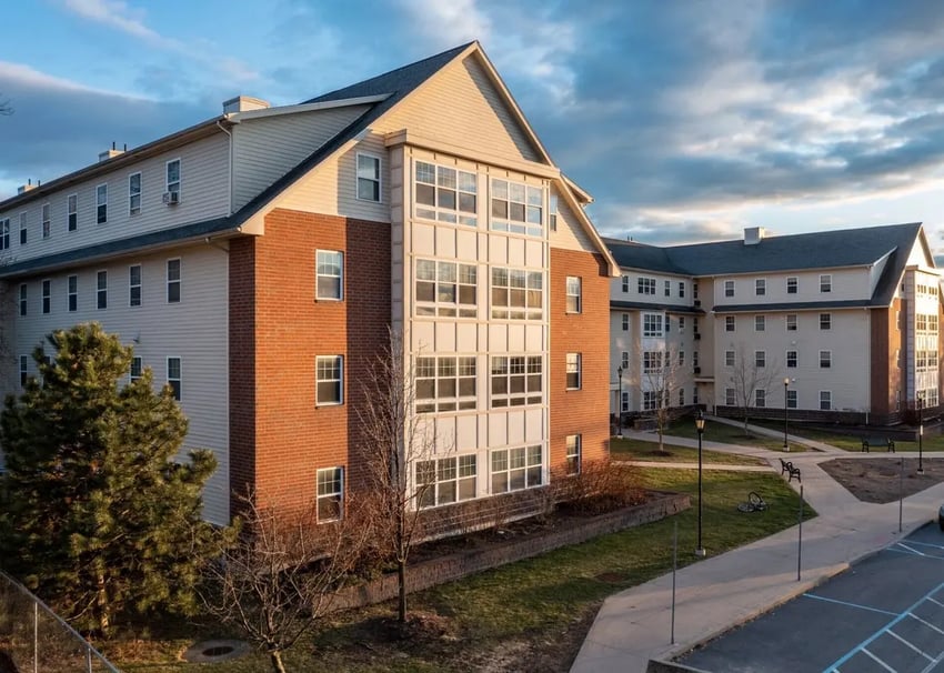 Apartment building with brick and siding exterior exterior at Broad Street Commons in Plattsburgh Student Accommodation