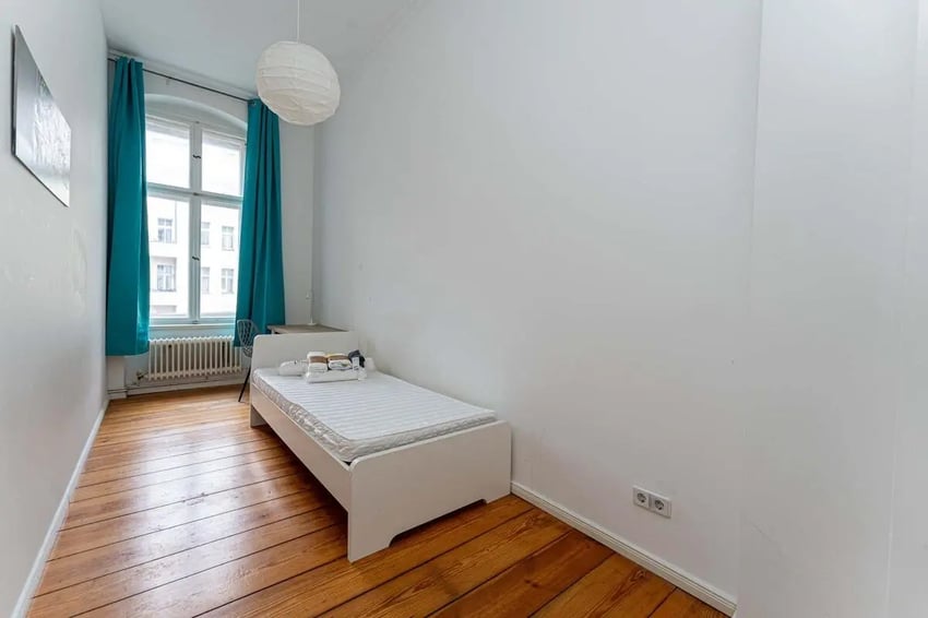 Bed desk and teal curtains bedroom at Kaiser-Friedrich-Straße - Room 4 in Berlin Student Accommodation
