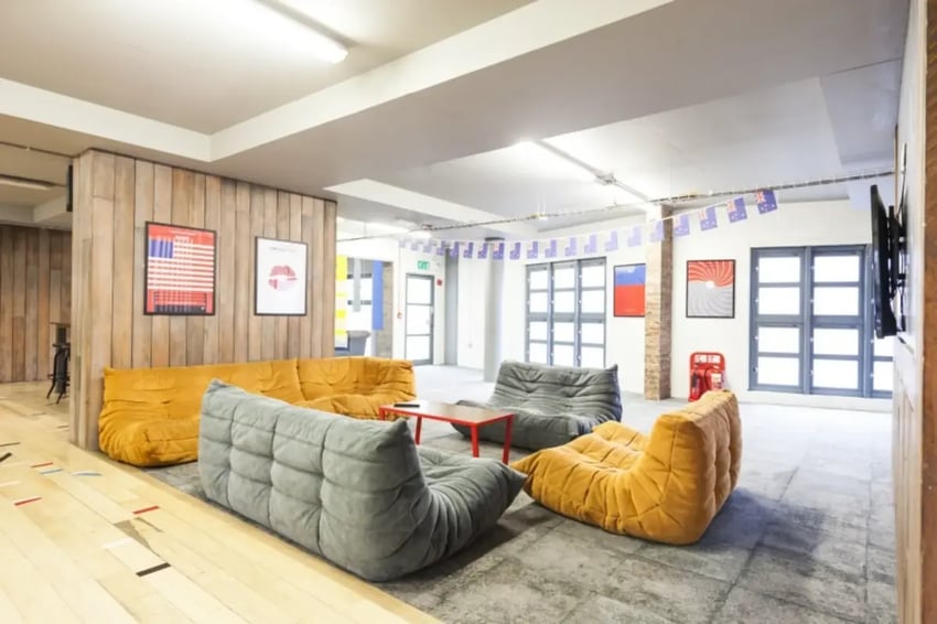 Sectional sofas with beanbag chairs common area at Mcmillan student Village in Greenwich Student Accommodation