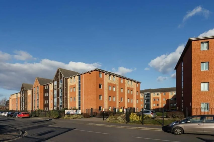 Brick student accommodation buildings with parking exterior at St Peters Court in Nottingham Student Accommodation