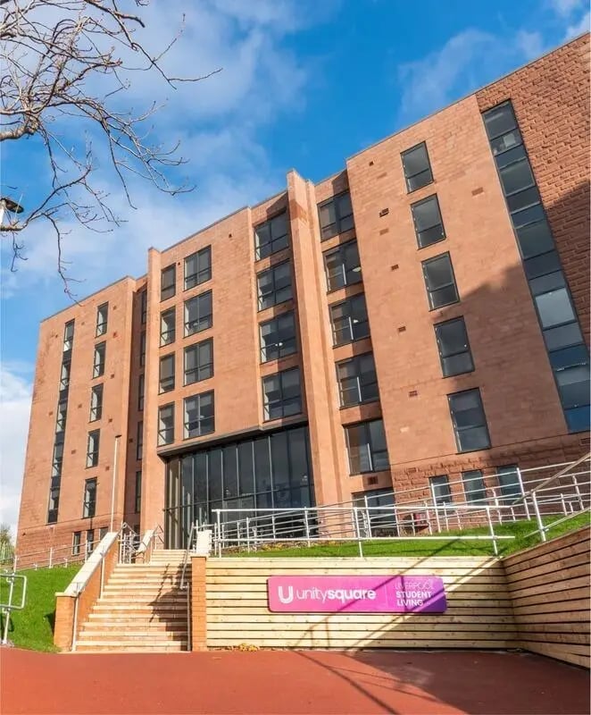Modern brick building entrance with stairs exterior at Unity Square in Liverpool Student Accommodation