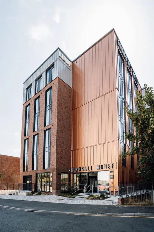 Brick building with copper facade exterior at Burnsall House in Coventry Student Accommodation