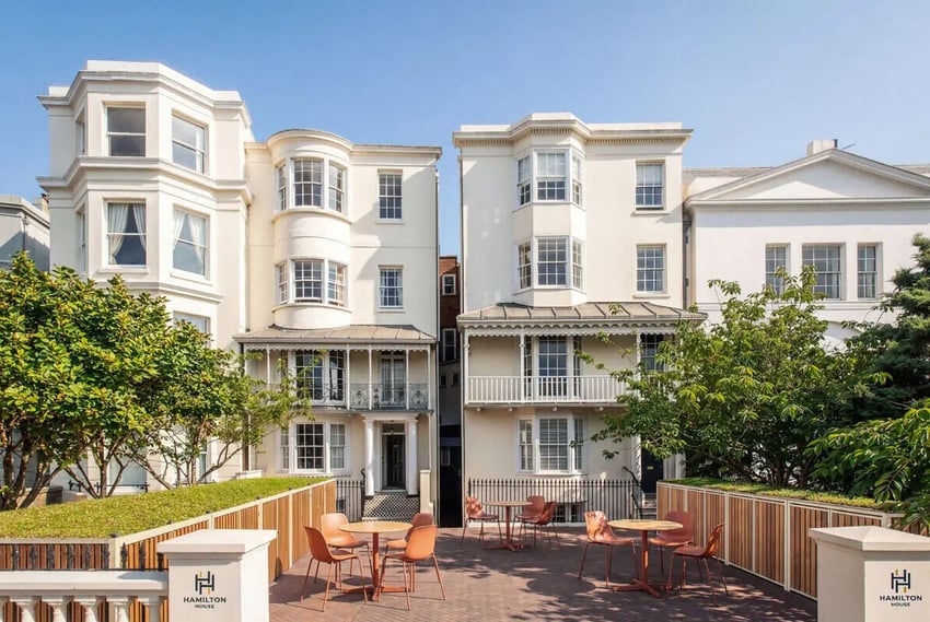 Apartment building with outdoor seating area exterior at Hamilton House in Brighton Student Accommodation