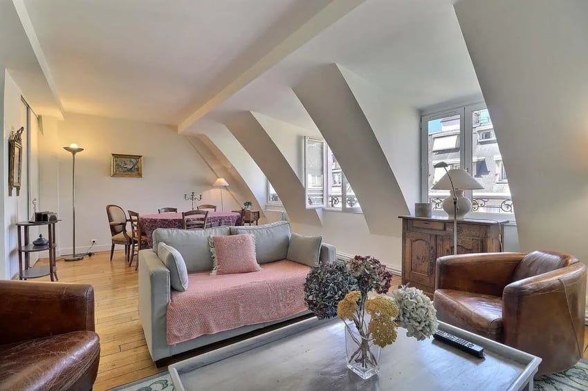 Sofa armchair dining table with chairs living room at Apartment in Rue César Franck, 75015 Paris, France in Paris Student Accommodation