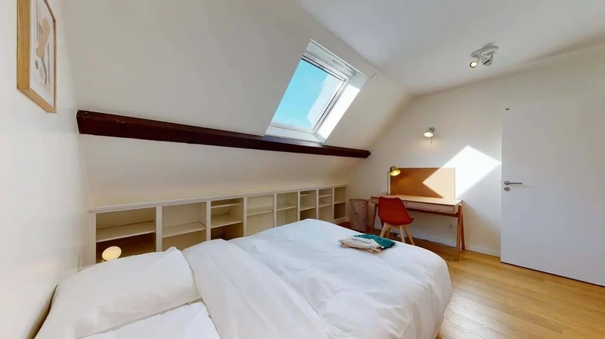 Bed desk chair shelves and skylight bedroom at Lucette - Private Room (10) in Pantin Student Accommodation