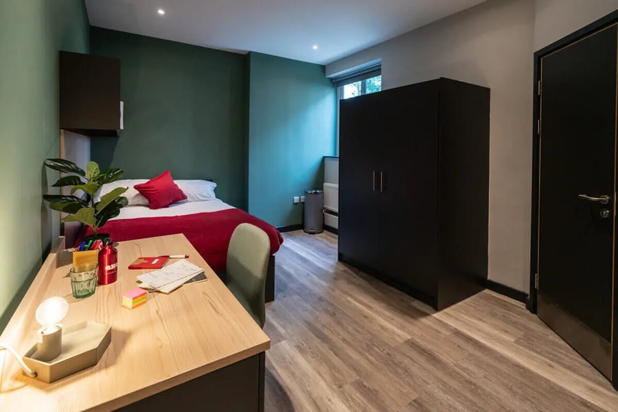 Bed desk wardrobe door and chair bedroom at AXO Sherbourne Student Village in Coventry Student Accommodation
