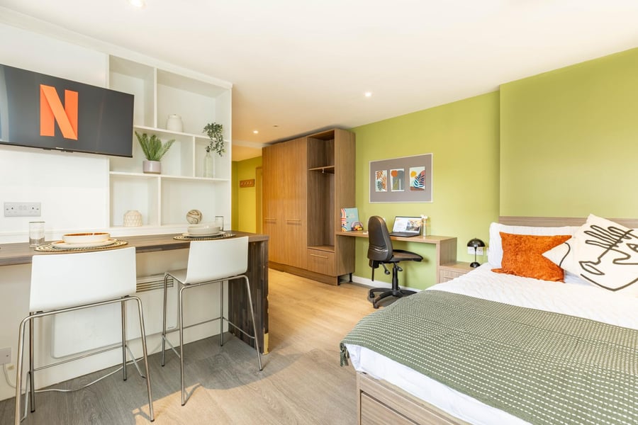 Netflix screen on shelf kitchen bed desk bedroom at Gallery Apartments in Glasgow Student Accommodation