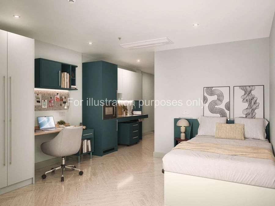 Bed desk wardrobe and kitchen area studio at Willen House in London Student Accommodation