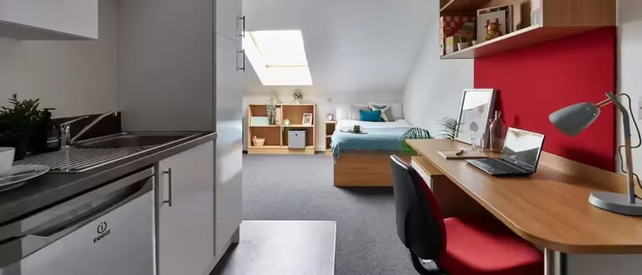 Kitchen desk bed with laptop bedroom study area at The Apollo Works in Coventry Student Accommodation