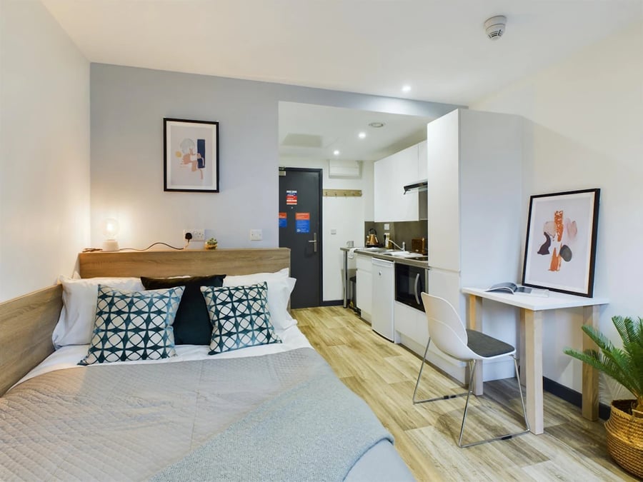 Bed kitchen area desk and chair studio at Eden Square in Coventry Student Accommodation